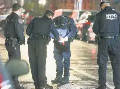  ??  ?? Officers work the scene of yet another weekend shooting in Brooklyn.