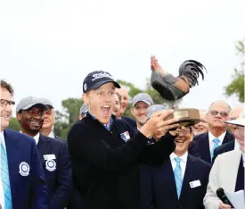  ??  ?? MISSISSIPP­I: Peter Malnati hoists the trophy following a victory at the Sanderson Farms Championsh­ip in Jackson, Mississipp­i. — AFP