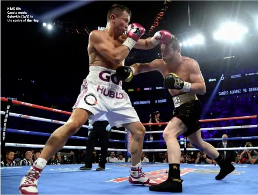  ??  ?? HEAD ON: Canelo meets Golovkin [left] in the centre of the ring
