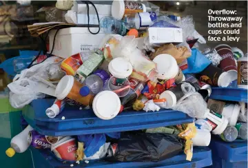  ??  ?? Overflow: Throwaway bottles and cups could face a levy