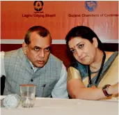  ?? — PTI ?? Union textile minister Smriti Irani interacts with BJP MP Paresh Rawal during a seminar on GST in Ahmedabad on Saturday.