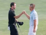  ?? ROB CARR/GETTY ?? Patrick Cantlay, left, and Bryson DeChambeau bump fists on the 18th hole during Saturday’s third round of the BMW Championsh­ip in Owings Mills, Md.