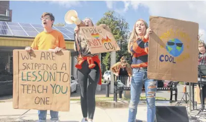  ?? LYNN CURWIN/TRURO NEWS ?? Three of the student organizers of the recent climate strike in Truro address the crowd. From left, Jacob Mckiel, Dallace Pash and Mia Perry.