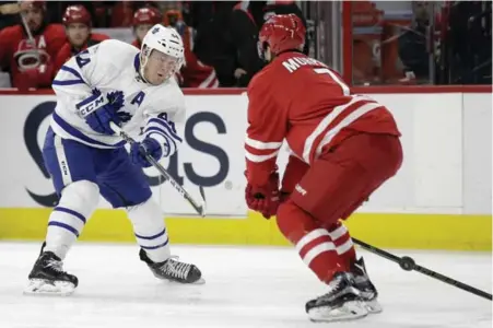  ?? GERRY BROOME/THE ASSOCIATED PRESS ?? Leaf Morgan Rielly, firing a shot past Ryan Murphy, scored the OT winner after two earlier defensive miscues proved costly.