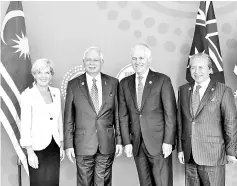  ??  ?? Prime Minister Datuk Seri Najib Tun Razak (second left) with Australian Prime Minister Malcolm Turnbull (second right) at the closing ceremony of the Counter-Terrorism Conference yesterday. Also present are Foreign Minister Datuk Seri Anifah Aman...