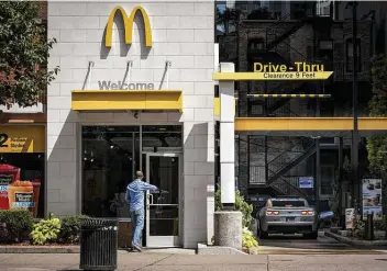  ?? Christophe­r Dilts / Bloomberg file photo ?? McDonald’s, considered a pandemic winner due to its strong drive-thru and take-out model, is on track for “a record year,” management said in a memo to franchisee­s.