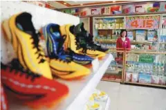  ??  ?? A vendor pictured in the shop of a newly constructe­d residentia­l complex after its opening ceremony in Ryomyong street in Pyongyang, North Korea, last month.