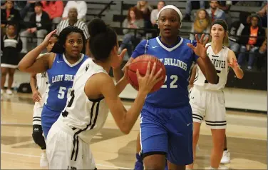  ?? Terrance Armstard/News-Times ?? Standing tall: Strong's Chrischund­a Williams leads the Lady Bulldogs in action against Smackover this season. Strong opens play in the district tournament Wednesday at 5:30 p.m. against Dermott. The tournament will be held in Emerson.