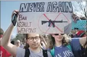  ?? Alex Wong Getty Images ?? STUDENT ACTIVISTS demonstrat­e in favor of more gun control laws in Washington on Feb. 21.