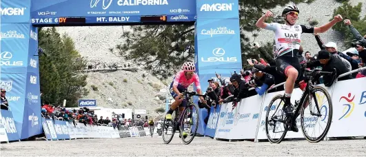  ??  ?? Pogačar celebrates his stage win atop Mount Baldy, where he effectivel­y won the general classifica­tion