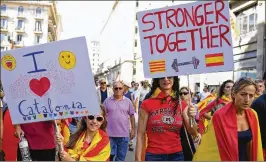  ?? JEFF J. MITCHELL / GETTY ?? Supporters of unity in Spain march through Barcelona on Sunday in response to last week’s disputed referendum on Catalan independen­ce. Catalan leader Carles Puigdemont is expected to declare the region’s independen­ce.