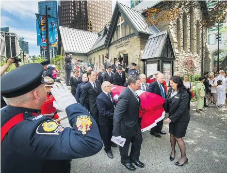  ?? ARLEN REDEKOP ?? Grace McCarthy’s casket is brought out of Christ Church Cathedral in Vancouver on Wednesday to a waiting horse-drawn hearse.