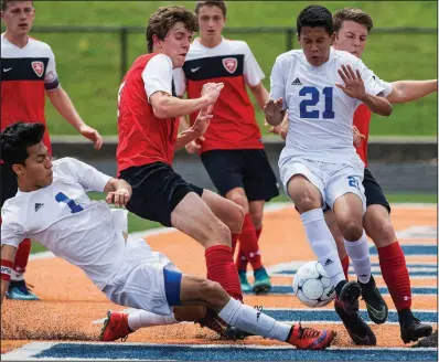  ?? NWA Democrat-Gazette/BEN GOFF ?? Willie Hernandez (1) of Rogers kicks the ball toward the net Thursday while teammate Nelson Rivas (21) tries to maintain his position during the Mounties’ 6-0 victory over Cabot in the Class 7A boys soccer state tournament at Gates Stadium in Rogers.