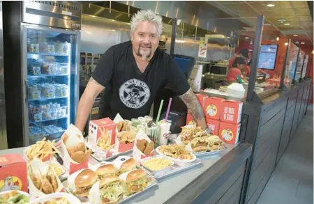  ?? CHICKEN GUY! ?? Food Network TV personalit­y Guy Fieri had opened a Chicken Guy! restaurant inside the Treats Food Hall at Aventura Mall.