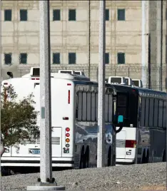  ?? JAmes QuIgg/The DAIly Press VIA AP, ?? In this June 8 file photo, Department of Homeland Security buses with detained immigrants aboard enter the Federal Correction­al Institutio­n in Victorvill­e, Calif.