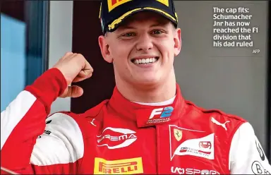  ?? AFP ?? The cap fits: Schumacher Jnr has now reached the F1 division that his dad ruled