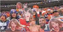  ?? BART YOUNG/ASSOCIATED PRESS FILE PHOTO ?? Broncos fans hold signs of Taylor Swift in the game against the Chiefs on Sunday in Denver.