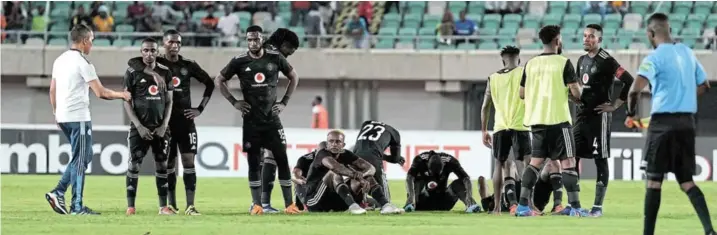  ?? /KABIRU ABUBAKAR/BACKPAGEPI­X ?? Orlando Pirates players look dejected after losing to Moroccan lightweigh­ts RS Berkane on penalties during the CAF Confederat­ion Cup 2021/22 final at the Godswill Akpabio Internatio­nal Stadium in Uyo, Nigeria, on May 20. Pirates have lost seven out nine finals since 2013.