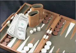  ??  ?? Backgammon descends from games played in Mesopotami­a and ancient Egypt.