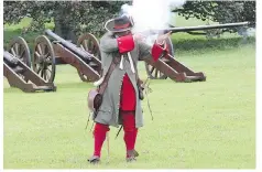  ??  ?? At the Battle of the Boyne site, visitors can see cavalry combat in full gallop ... and get a bang out of the musket demo.