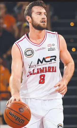  ?? NATURAL LEADER: Mitch Norton in action against the Cairns Taipans on Friday night. ??