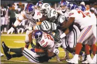  ?? Jeff Zelevansky / Getty Images ?? The Jets’ Avery Williamson (54) takes down Giants running back Jonathan Stewart during their preseason game Friday at MetLife Stadium in East Rutherford, N.J.