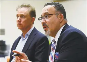  ?? Erik Trautmann / Hearst Connecticu­t Media ?? State Education Department Commission­er Miguel Cardona and Gov. Ned Lamont are shown on Feb. 28 at Silvermine Dual Language Magnet School in Norwalk.