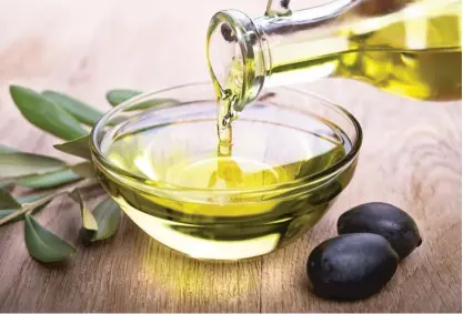  ?? ?? ABOVE: Opt for healthier oils such as olive oil for your salads and savory recipes.