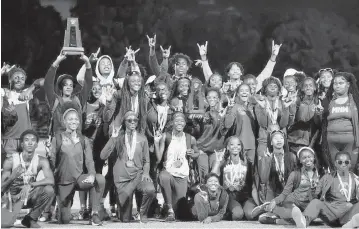  ?? Miami Herald file ?? The Northweste­rn girls’ track and field team, seen here with the Bulls’ boys’ team after winning districts three weeks ago, won a 14th consecutiv­e state team title on Friday in Jacksonvil­le.