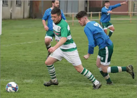  ??  ?? Eamonn O’Brien of Shamrock Rovers is tracked by Tommy McVeigh of Enniscorth­y Town.