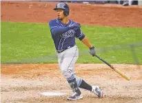  ?? FRANK FRANKLIN II/ASSOCIATED PRESS ?? The Rays’ Francisco Mejia follows through on an RBI double during the ninth inning of Saturday’s game against the Yankees in New York. The Rays won 6-3.