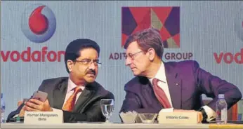  ?? PTI ?? Aditya Birla Group chairman Kumar Mangalam Birla (left) with Vodafone Group CEO Vittorio Colao, in Mumbai on Monday