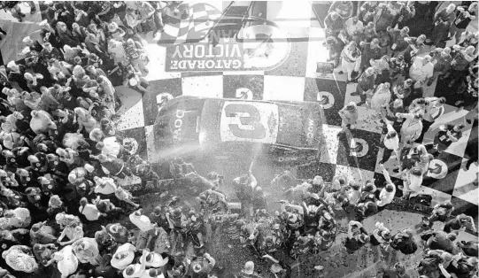  ?? ROBERT LABERGE/GETTY IMAGES ?? Austin Dillon, who led only the final lap of Sunday’s 60th Daytona 500, lets loose in celebratio­n in Victory Lane after winning the NASCAR Cup season opener in grand fashion.