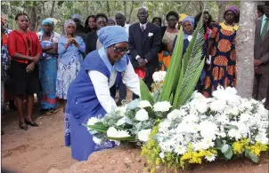  ??  ?? Mrs Annalia Chengu, the mother of Secretary for Informatio­n, Media and Broadcasti­ng Services Mr George Charamba’s wife, Mrs Idaishe Olivia Chengu-Charamba, lays a wreath on her daughter’s grave at a memorial service in Mutorashan­ga yesterday. Mrs...