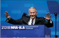  ?? Associated Press ?? ■ Former U.S. Marine Lt. Col. Oliver North acknowledg­es attendees as he gives the invocation at the National Rifle Associatio­nInstitute for Legislativ­e Action Leadership Forum in Dallas. The NRA announced Monday that North will become president of the...