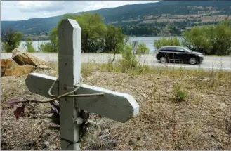  ?? Daily Courier file photo ?? Roadside memorials placed to honour victims of car crashes are rarely removed by City of Kelowna crews.