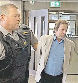  ?? HARRY SULLIVAN/TC MEDIA ?? Gerald Rushton is seen being led by sheriff’s deputies from a Halifax courtroom on Thursday morning after pleading guilty to the December 2013 deaths of his common-law spouse Elizabeth MacPherson and her daughter Brittany.