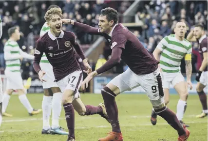  ??  ?? Harry Cochrane celebrates his goal against Celtic. In tying him up for three years, Hearts have a star in the making.