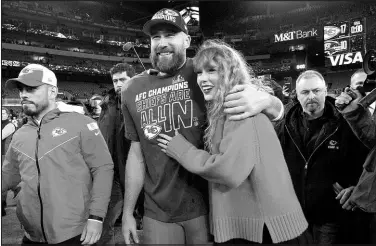  ?? JULIO CORTEZ / ASSOCIATED PRESS ?? Kansas City Chiefs tight end Travis Kelce walks with Taylor Swift following the his team’s win Jan. 28 against the Baltimore Ravens in Baltimore.