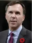  ?? ADRIAN WYLD/THE CANADIAN PRESS ?? Finance Minister Bill Morneau challenged Tory MPs to reveal details of their private corporatio­ns.