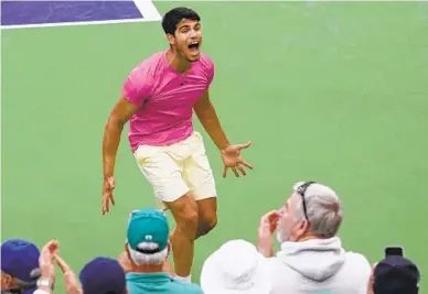  ?? MARK J. TERRILL AP ?? Carlos Alcaraz celebrates after beating Daniil Medvedev in the men’s singles final at the BNP Paribas Open on Sunday.