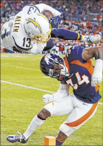  ?? David Zalubowski The Associated Press ?? Chargers receiver Keenan Allen leaps over Broncos safety Will Parks for a touchdown Dec. 1 in Denver. Several betting contests will be decided in the next three weeks.