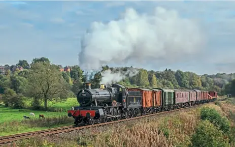  ?? ?? BR(W) Collett 4-6-0
No. 7820 Dinmore Manor,
from the Gloucester­shire Warwickshi­re Railway, was one of two replacemen­t guest engines at the East Lancashire Railway gala following A4 No. 60009 Union of South Africa’s
failure, the other being Ivatt 2MT 2-6-2T No. 41312. Both were making their debuts on the ELR, something which the line's volunteer financial director David Layland described as “quite unusual for us – it probably attracted a few extra people.” Here the Manor heads the 3.10pm Bury to Ramsbottom goods train in a short burst of sunshine at Burrs on October 16. MARTYN TATTAM