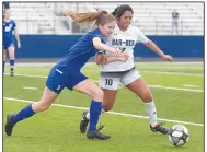  ?? NWA Democrat-Gazette/J.T. WAMPLER ?? Rogers’ Samantha Todd tries to get the ball from Springdale Har-Ber’s Giselle Estrada on Wednesday. Rogers won 4-2 in a shootout after tying 0-0 in regulation time.