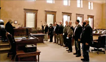  ?? (Caitlan Butler/News-Times) ?? Union County Justices of the Peace swear their oaths of office before Judge Mary Thomason on Friday, Jan. 1.