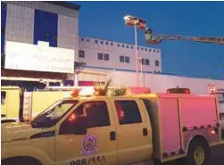  ??  ?? Members of Saudi Civil Defence work at Jazan General Hospital following a pre-dawn fire in the port city yesterday.