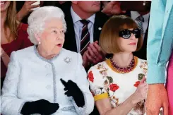 ?? ?? Royal approval: The Queen sits with Vogue editor Anna Wintour at a Richard Quinn show in 2018