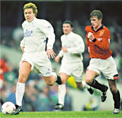  ??  ?? Christmas Eve cracker: Tomas Brolin of Leeds United runs past Manchester United’s David Beckham on Dec 24, 1995, the last Premier League fixture to be played on Christmas Eve