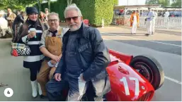  ?? ?? 4. Steve Tillack (foreground) waits to move to the dummy grid with support from Brittany Wilson and mechanic Andy. His car is a Lancia D50, a Jim Stokes recreation to Vittorio Jano’s original design using many period-correct and original parts;