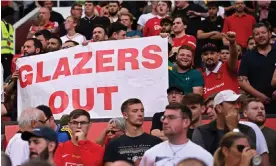 ?? Oli Scarff/AFP/Getty Images ?? Manchester United fans protest against the club’s owners earlier this season. Photograph: